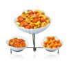 a bowl of oranges sitting on top of a table 