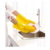 a yellow banana sitting on top of a refrigerator 